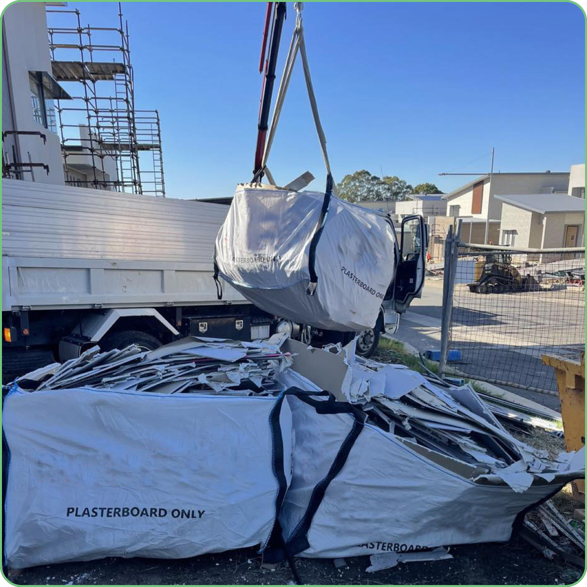 PlastaGo plasterboard-only bags being craned from a construction site